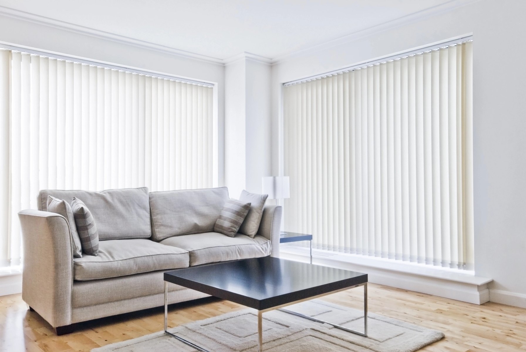 bright living room with vertical blinds